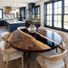 Dining area with a wooden table and chairs in a modern kitchen.