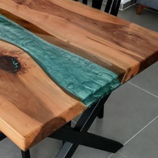 Handcrafted epoxy dining table with solid wood base, ideal for modern home decoration.