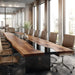 Long wooden conference table with chairs in a modern office setting