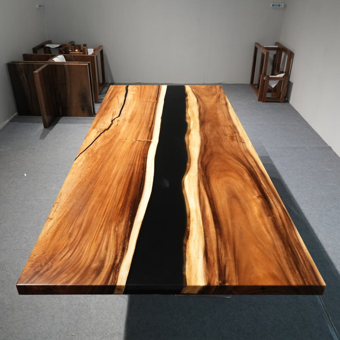 Modern walnut dining room table with dramatic black epoxy resin