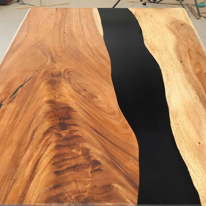 Top view showcasing the black epoxy resin and natural walnut patterns.