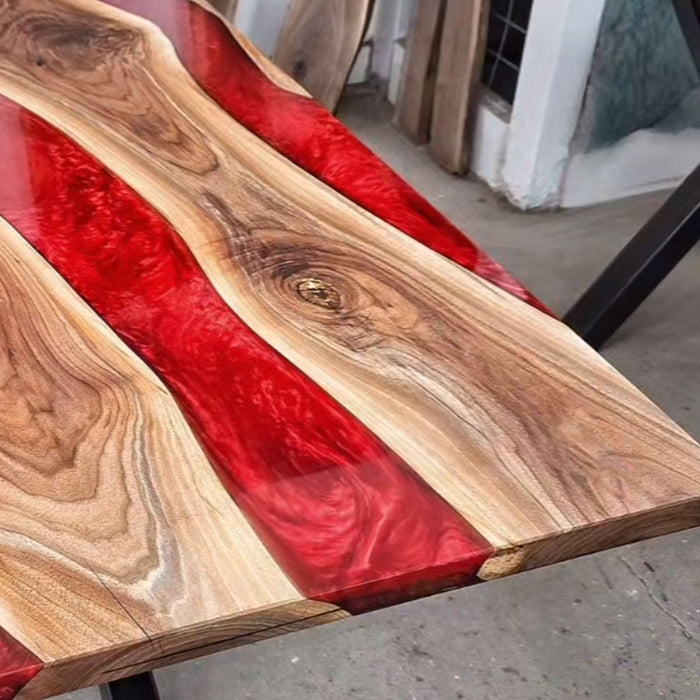 Modern river-style dining table crafted from walnut and epoxy