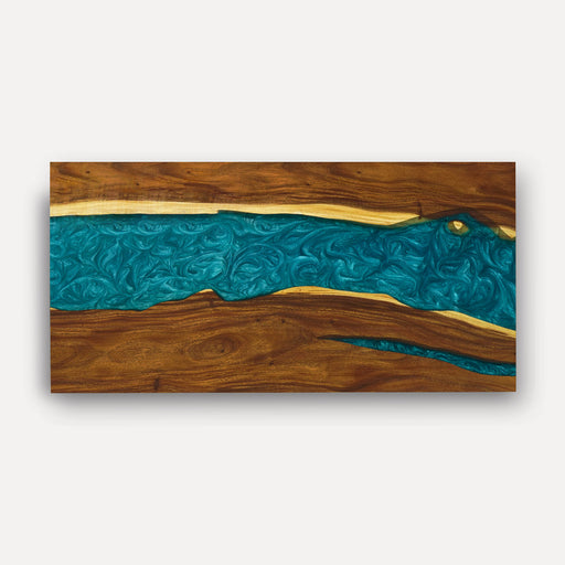 Wooden panel with blue resin inlay on a white background