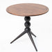 Modern walnut side table with sculptural black tripod legs and round wood top.