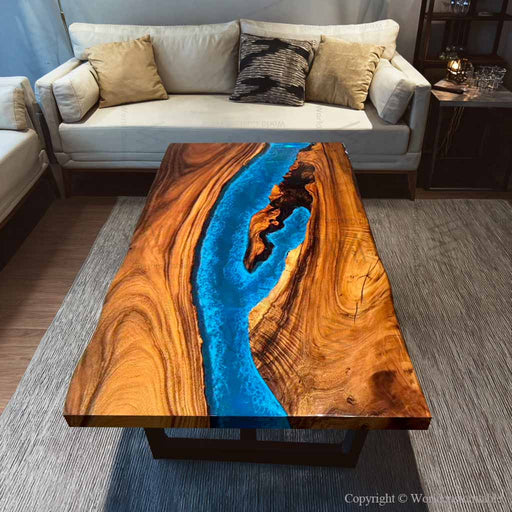 Modern handcrafted walnut wood and epoxy resin furniture set in a living room.