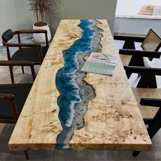 Handmade epoxy river table with live edge wood, featuring a stunning ocean wave design that blends natural textures with modern aesthetics.