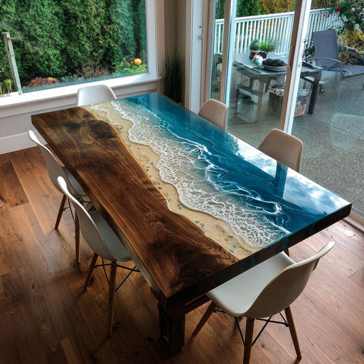 square wooden epoxy river table with white  chairs