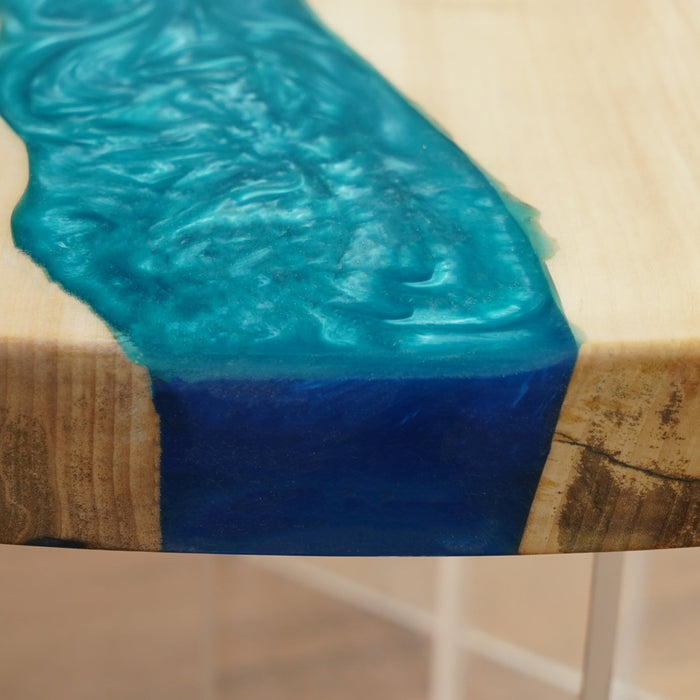 Unique live edge table with glossy epoxy finish.