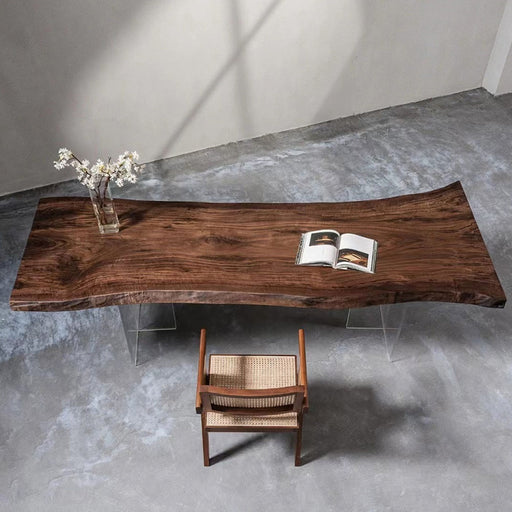 Modern natural walnut wood dining table with rustic edges and minimalist chair