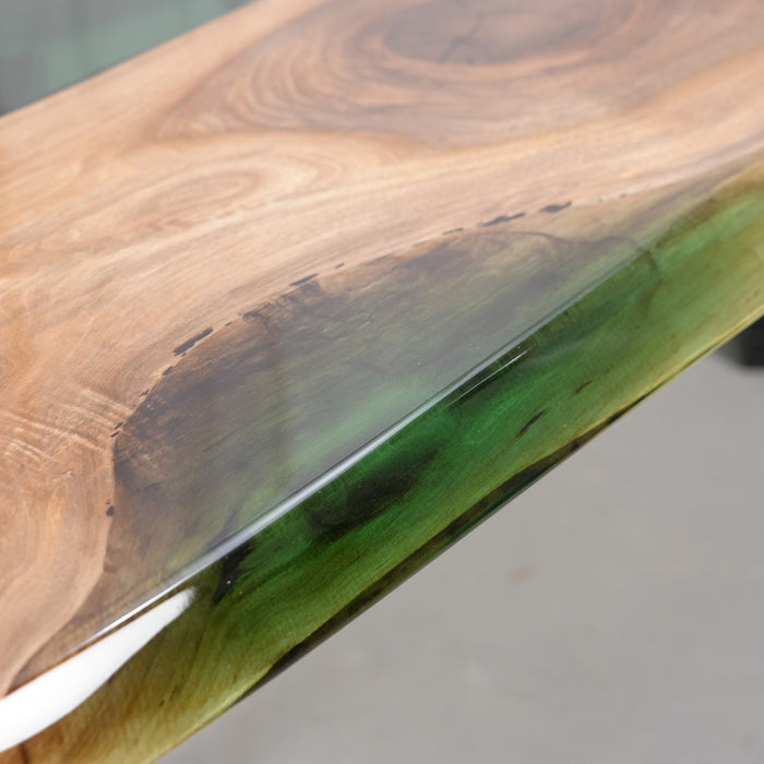 Wooden surface with a green resin inlay