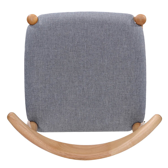 Gray cushioned rocking chair with wooden arch and knobs on a white background
