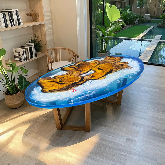 Handmade resin table with golden camphor wood and glossy blue ocean effect