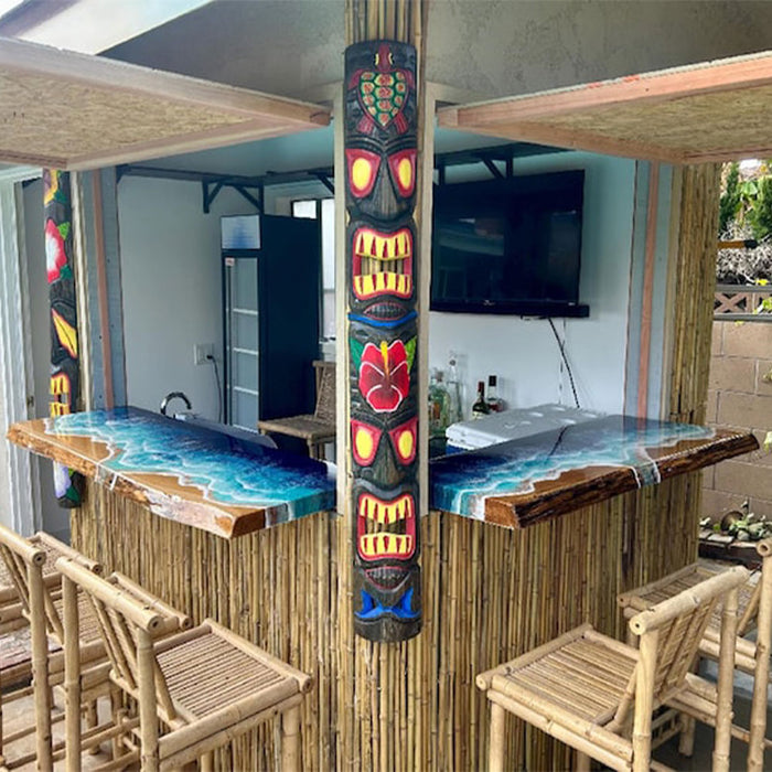 Handcrafted ocean-themed resin high table with wood base and stools, ideal for coastal homes or cafes.