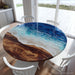 Ocean-inspired epoxy river table featuring detailed wave patterns