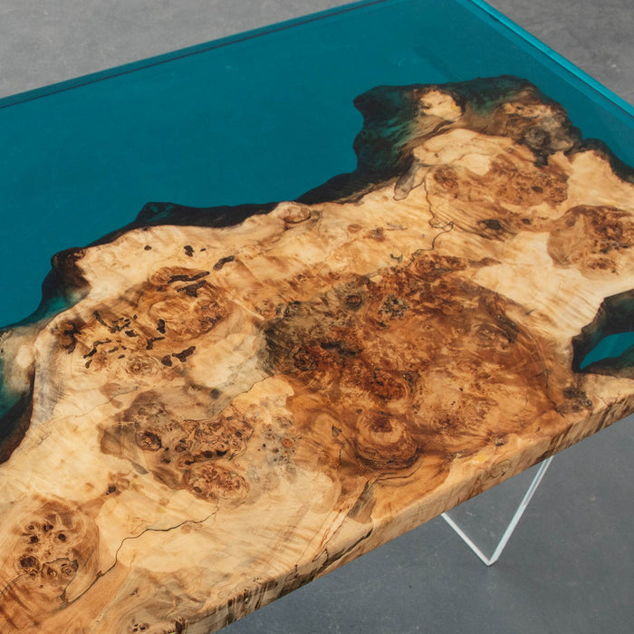 Ocean-inspired epoxy and burl wood desk for luxury interiors