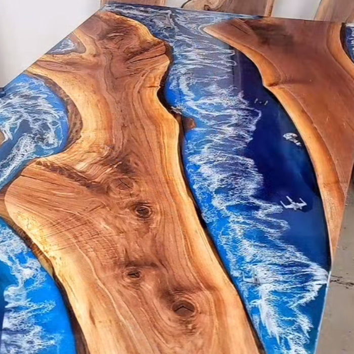 Discover this handcrafted walnut ocean epoxy table with wave details – the perfect coastal-style centerpiece for luxury dining and beachfront interiors.