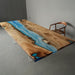 Ocean wave epoxy dining table with natural golden camphor wood grain
