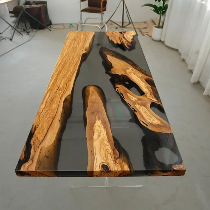 Elegant olive wood and black resin table in a culinary studio setting