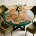 Olive burl wood round dining table with vibrant green epoxy resin border, live-edge river design