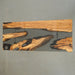 Elegant olive wood and black resin table in a culinary studio setting