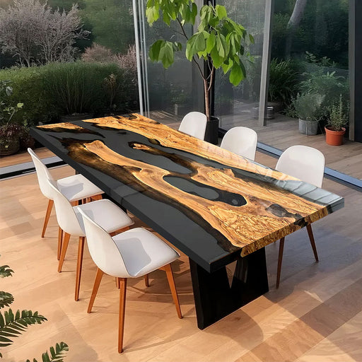 Olive wood dining table with transparent resin in a glasshouse meeting space