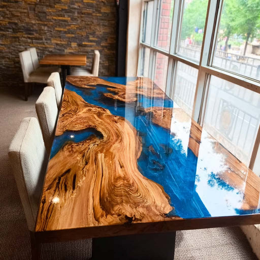 olive wood dining table with vibrant blue epoxy resin river, ocean-inspired handcrafted kitchen furniture