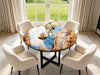 Round olive wood coffee table with blue epoxy resin river design and black metal legs, living room setting