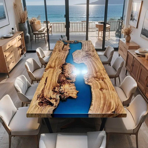 Dining room with a unique wooden table featuring a blue resin river design, surrounded by chairs.