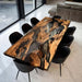 Olive wood epoxy table styled in an open kitchen interior