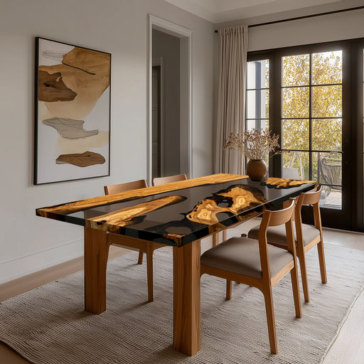 Dining room with a modern black and wood dining table, chairs, and abstract art on the wall.