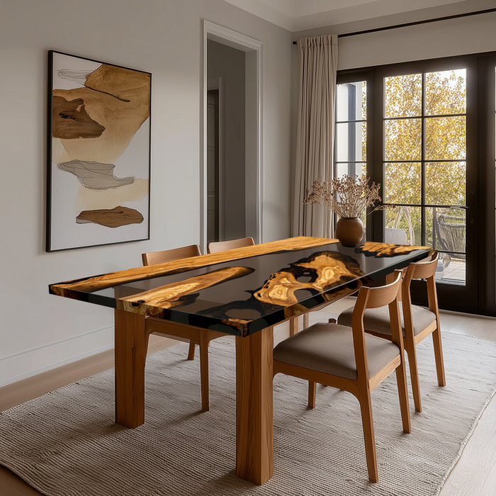 Dining room with a modern black and wood dining table, chairs, and abstract art on the wall.