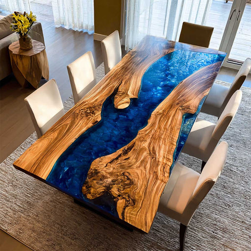 Dining table with wooden and blue epoxy design in a room with chairs and decor.