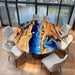 Custom round olive wood dining table with blue ocean epoxy