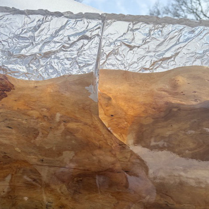 Close up detail of olive wood epoxy resin tabletop