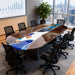 Oval black walnut conference table with blue resin river in modern office