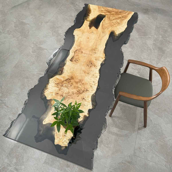 Front view of the S72 poplar live edge coffee table featuring translucent black epoxy and an 87” x 33” surface for 8 people.