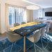 Straight-edge dining table combining natural poplar wood and translucent deep blue resin with black resin accents.