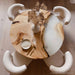 Custom round poplar wood dining table with white epoxy resin river design.
