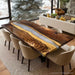 Dining room with a wooden table and chairs in a modern interior setting.