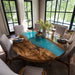 Dining room with a unique table design featuring a wooden top and blue resin.