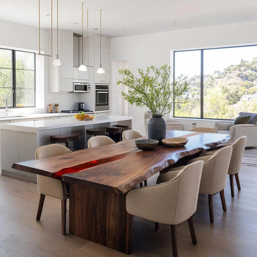 Modern kitchen with a wooden dining table and chairs, featuring a vase with greenery.