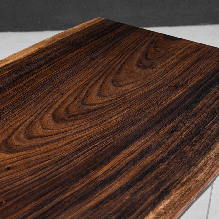 Rare rain tree wood table handcrafted from a single solid slab, perfect for modern and rustic spaces.
