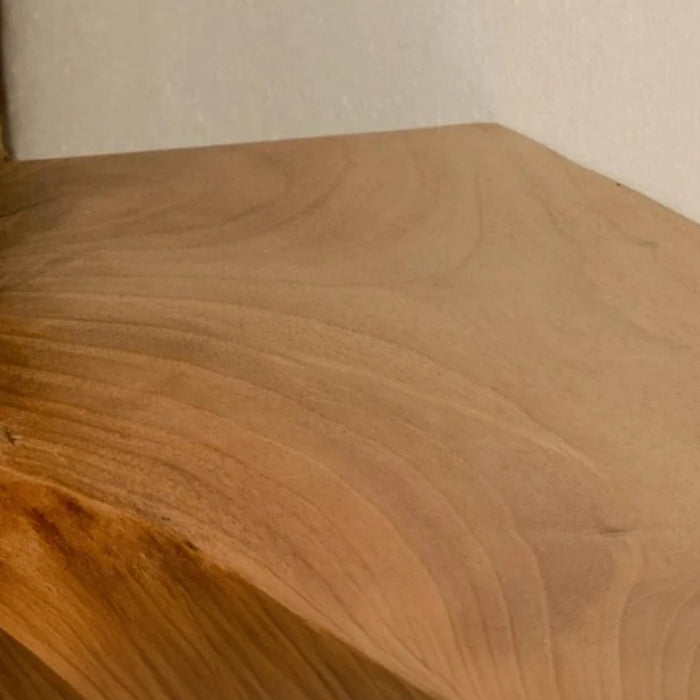 Close-up of a wooden surface with visible grain and texture.