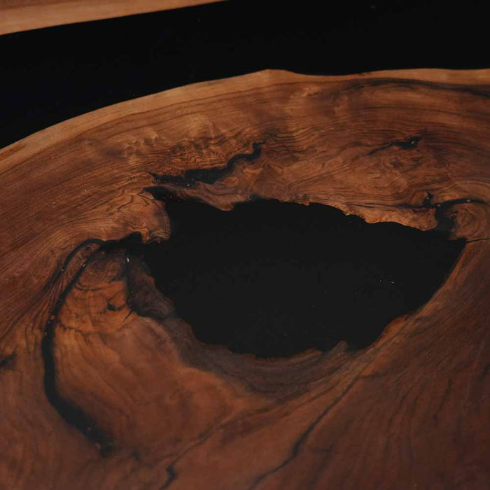 Close-up of a wooden surface with a dark knot