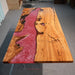 Red swirl epoxy dining table with distinctive natural wood grain