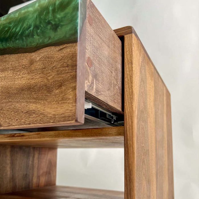Resin wood bedside table featuring green epoxy and luxury design.
