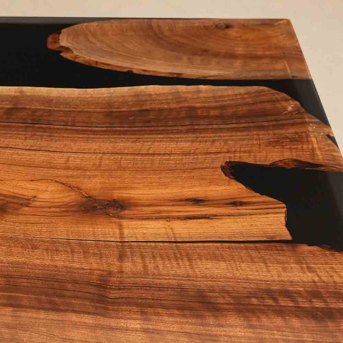 Wooden table with a black metal base
