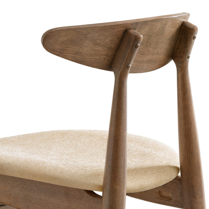 Wooden chair with beige cushion on a white background