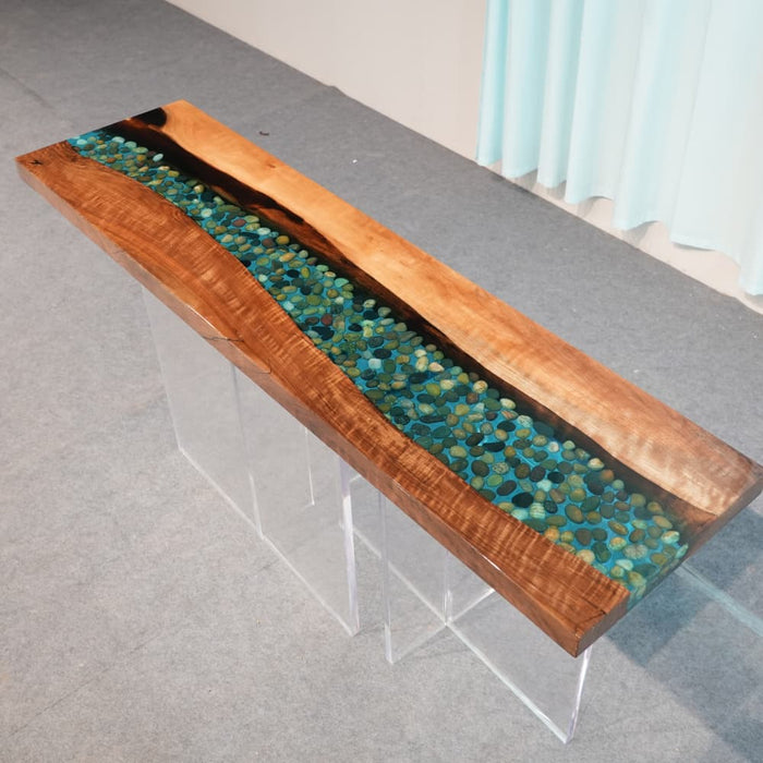 Rock embedded epoxy console table with natural walnut grain