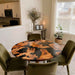Round epoxy dining table creating an elegant centerpiece in a luxury dining room